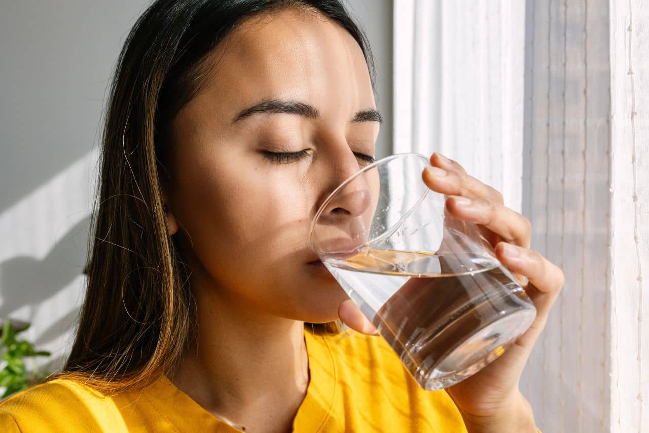 Woman drinking a glass of water