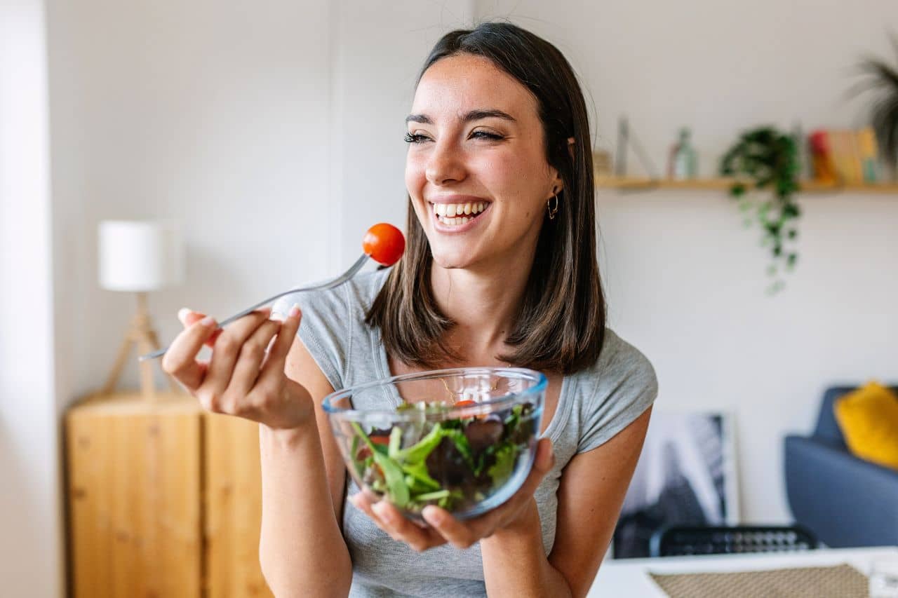 Woman eating healthy salad
