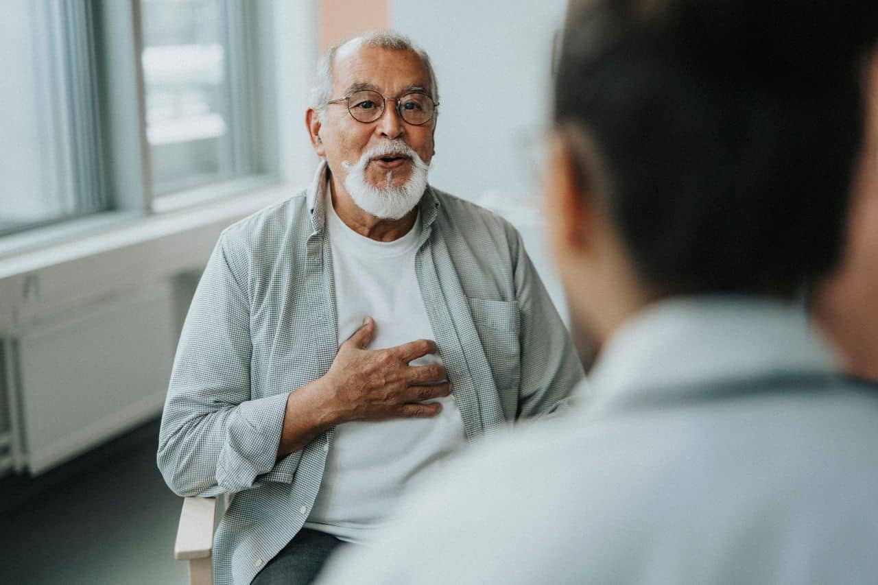 Man talking with doctor about what a stroke feels like