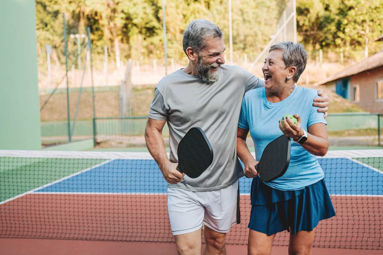 Laughing couple after pickleball match.