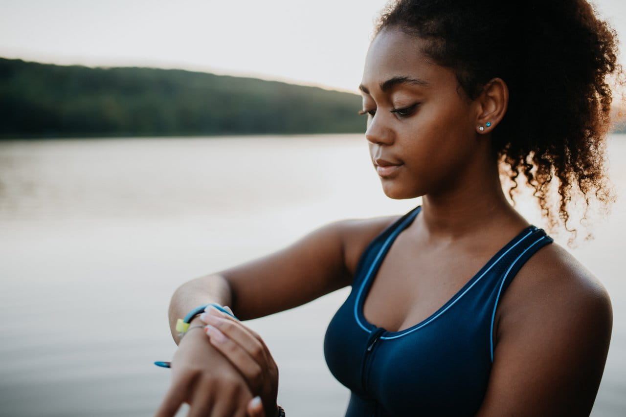 African American woman with smart watch fitness wearable