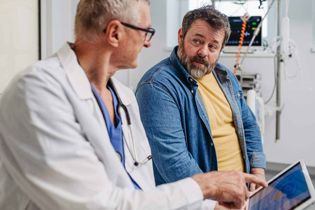 Doctor and patient talk about lung x-rays