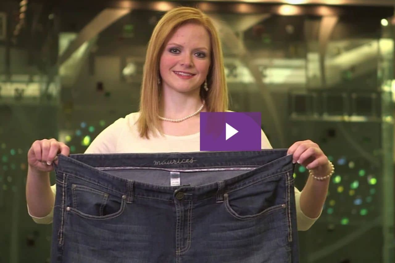 Woman holding up pants