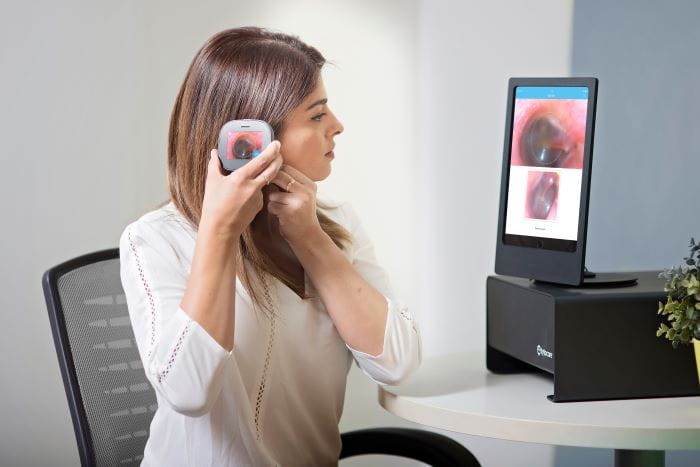 woman using tytoclinic for ear exam