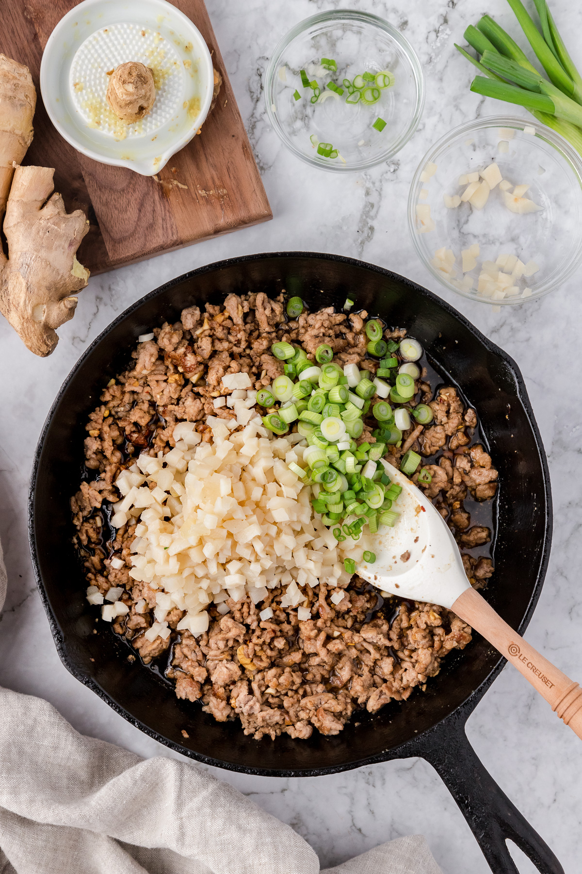 Cooking Asian lettuce wraps in skillet.