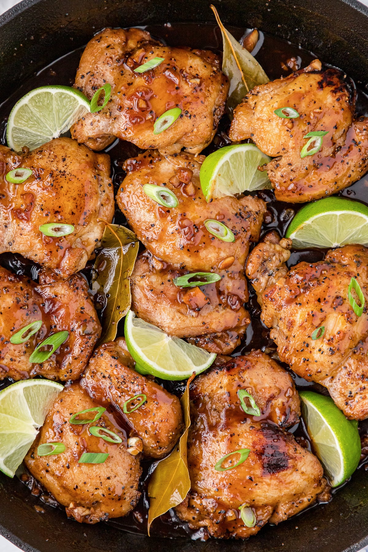 Adobo chicken in skillet.