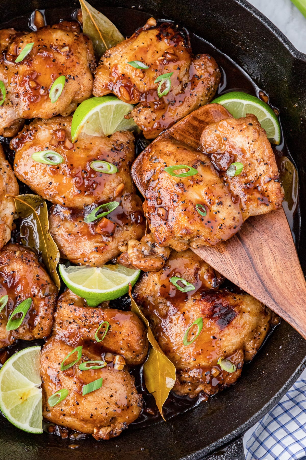 Chicken adobo in skillet.