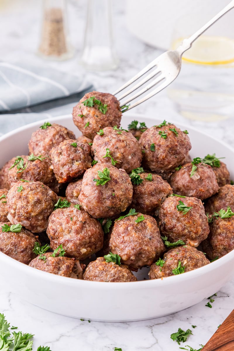 Meatballs in a bowl with a fork.