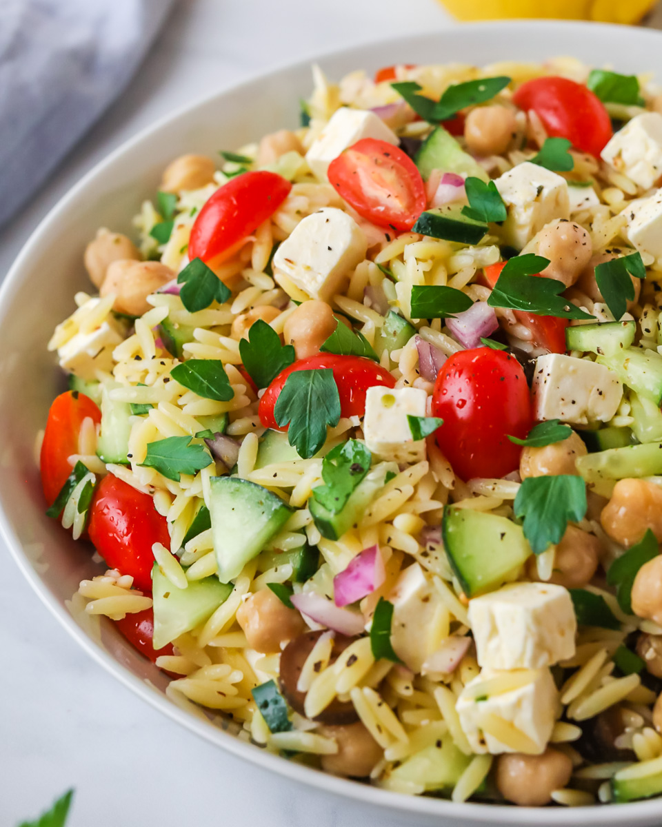 Orzo pasta salad in bowl.