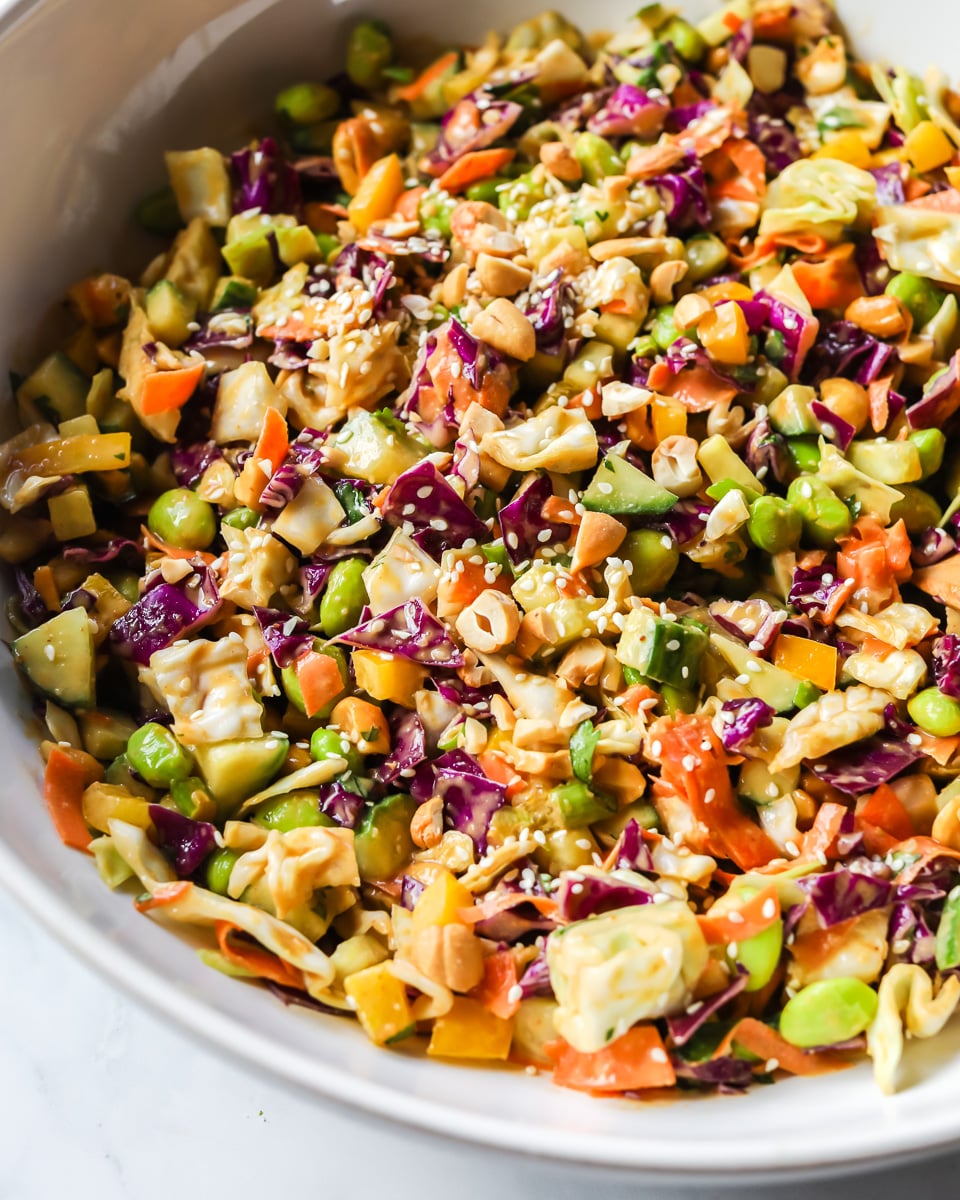 Thai crunch salad in a white bowl.
