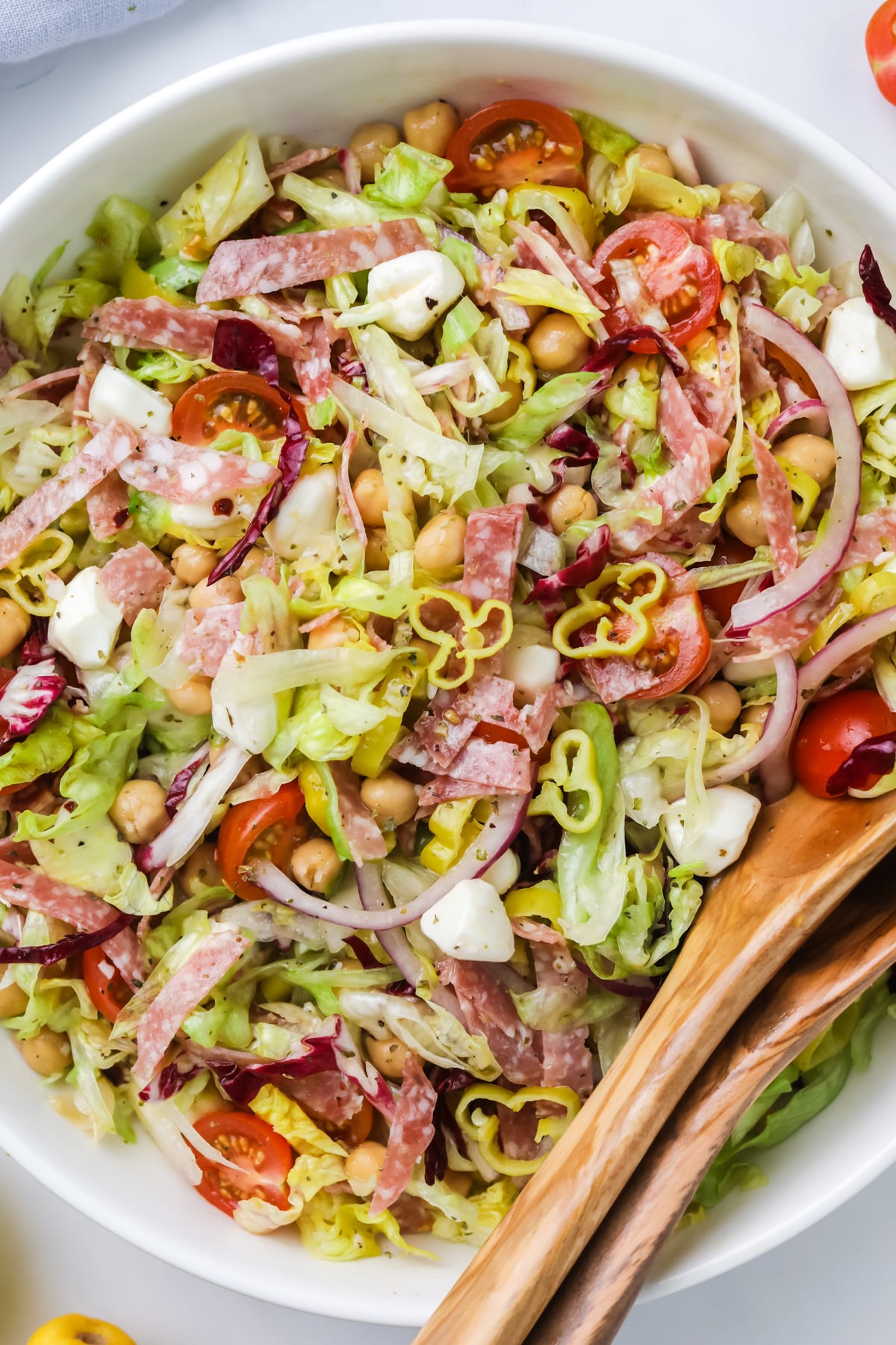 Italian chopped salad with salami and mozzarella.