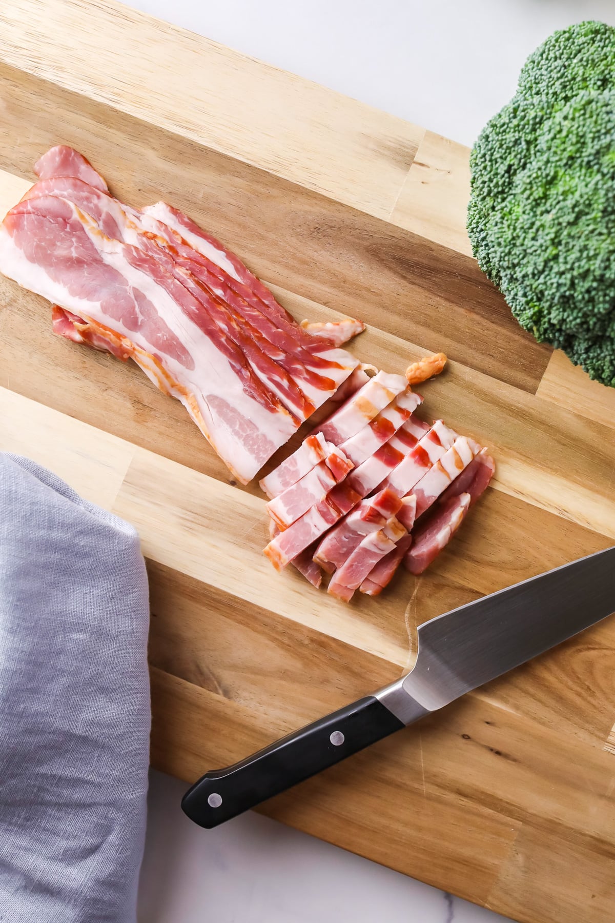 Slicing bacon for broccoli salad.