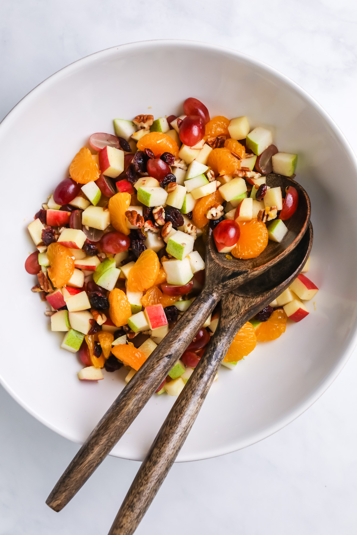 Thanksgiving fruit salad in a white bowl.