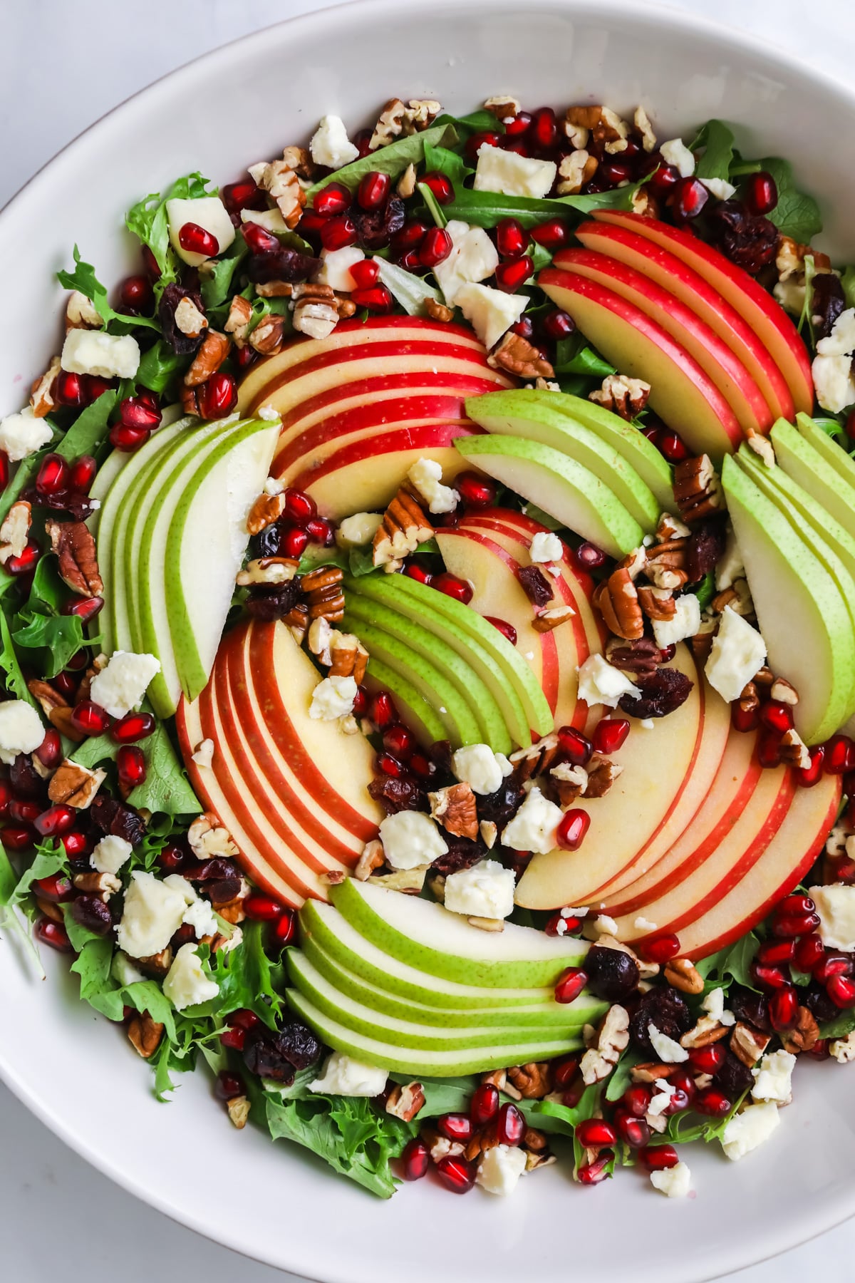 Thanksgiving salad in white bowl.