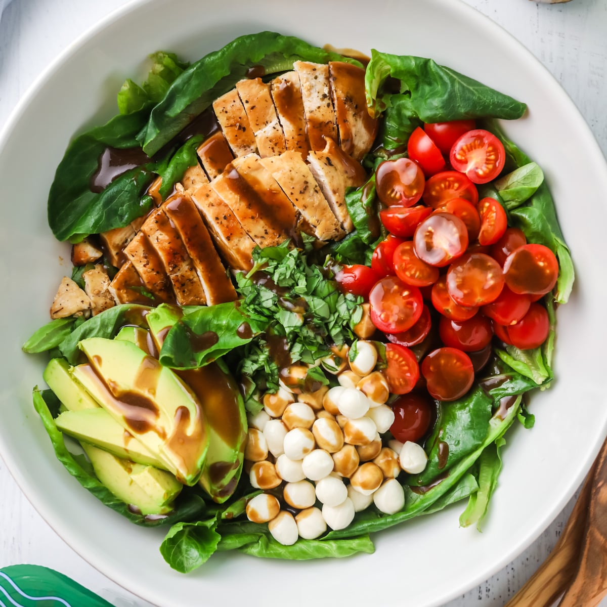 Chicken caprese salad with avocado.