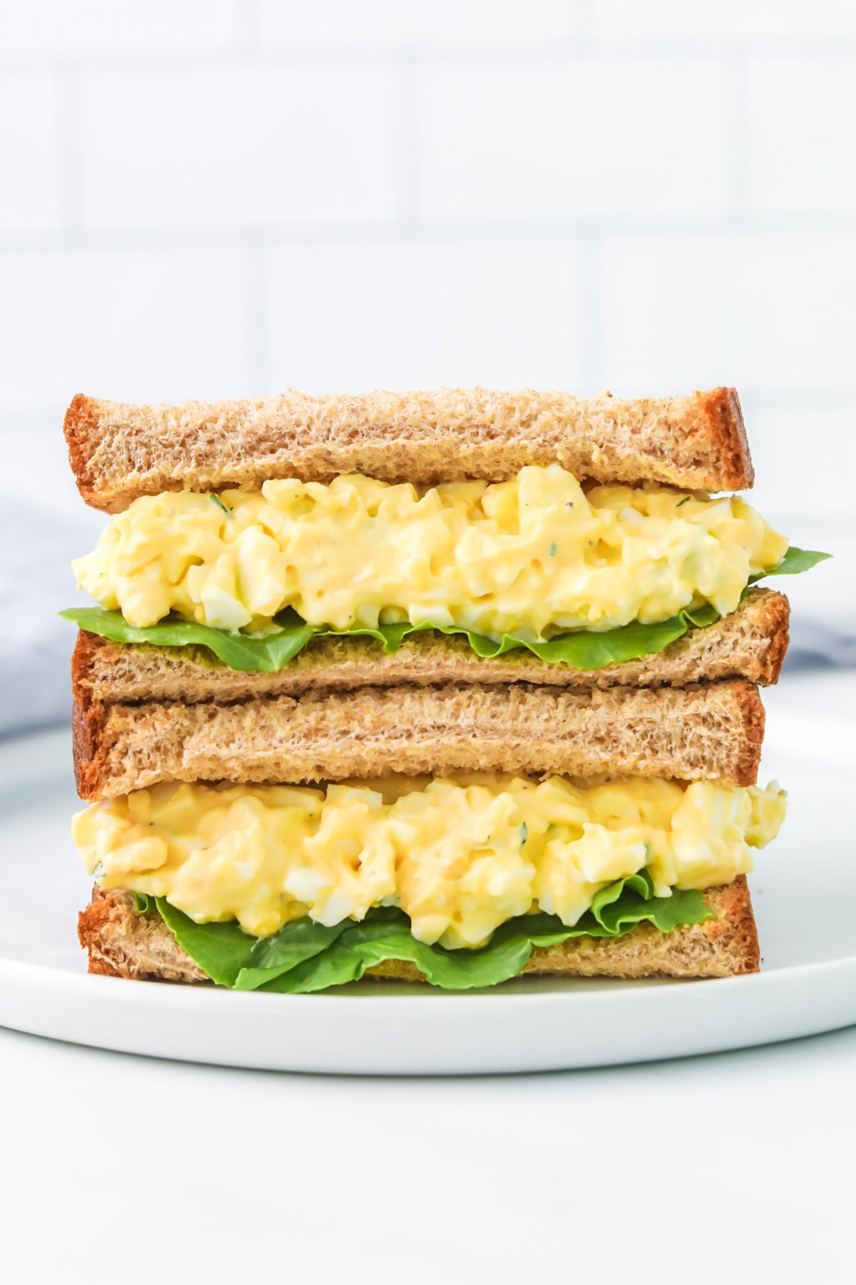 egg salad sandwich with lettuce.