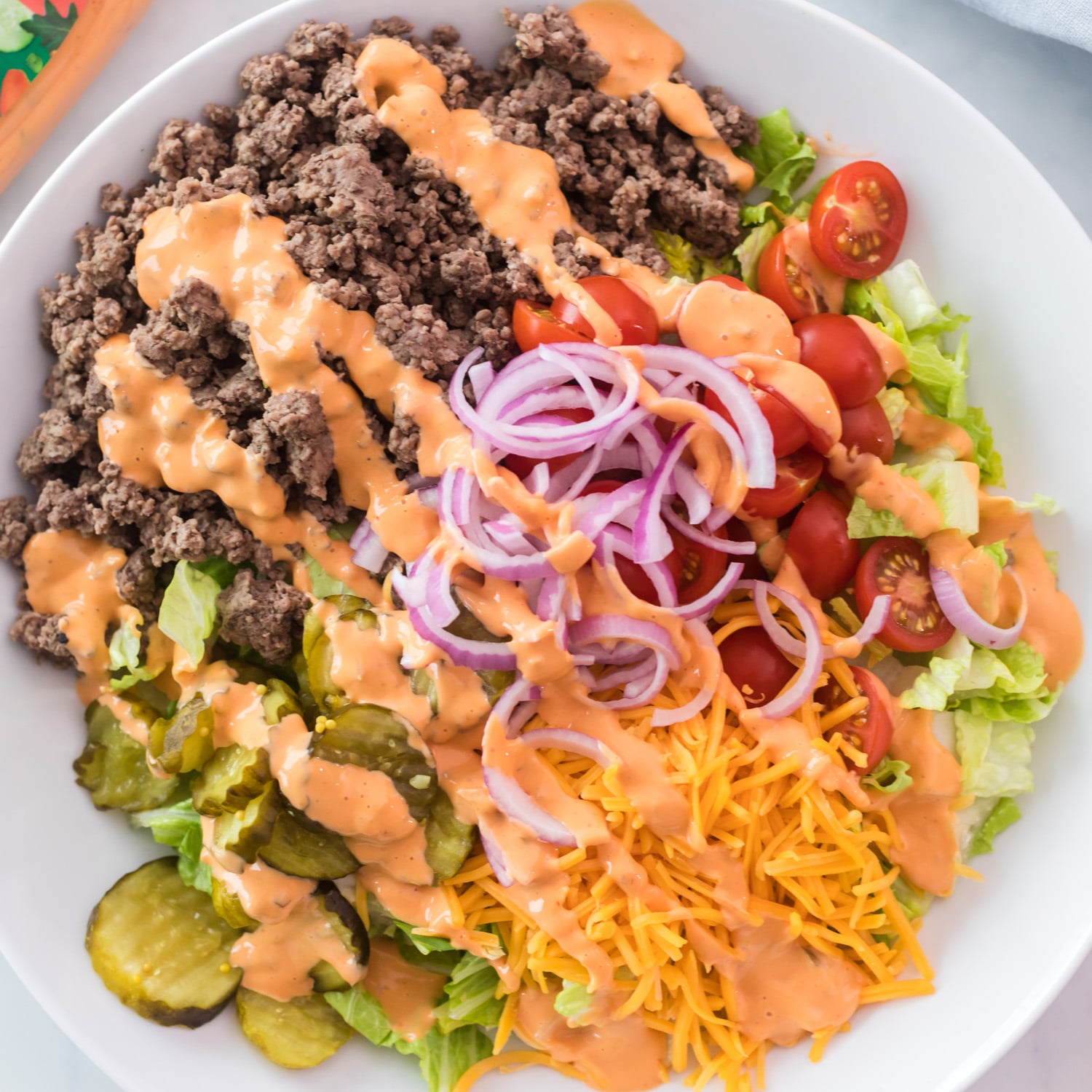 Cheeseburger salad with creamy dressing.