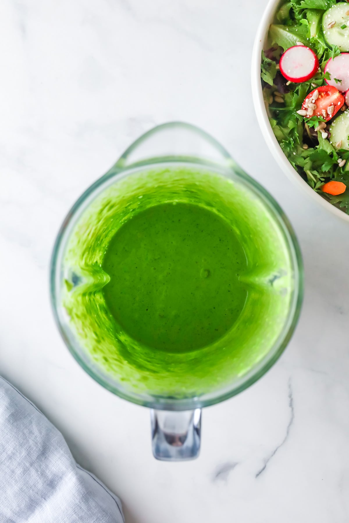 Making green goddess dressing in a blender.