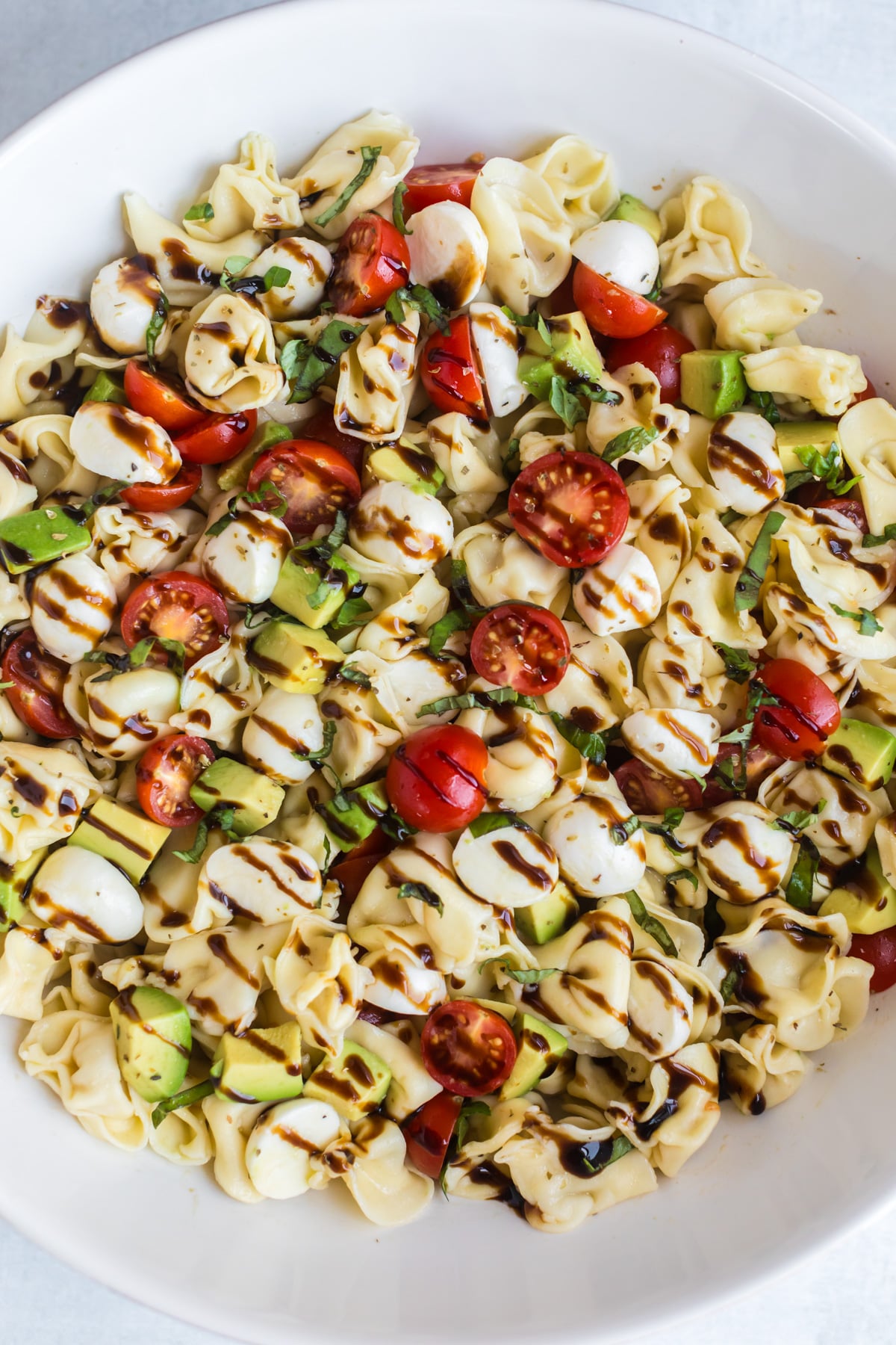 Caprese tortellini pasta salad with balsamic dressing.