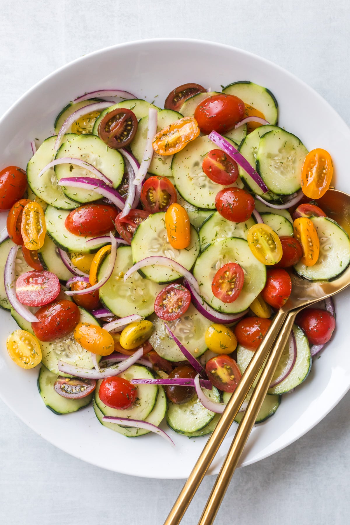 Cucumber tomato salad in bowl.