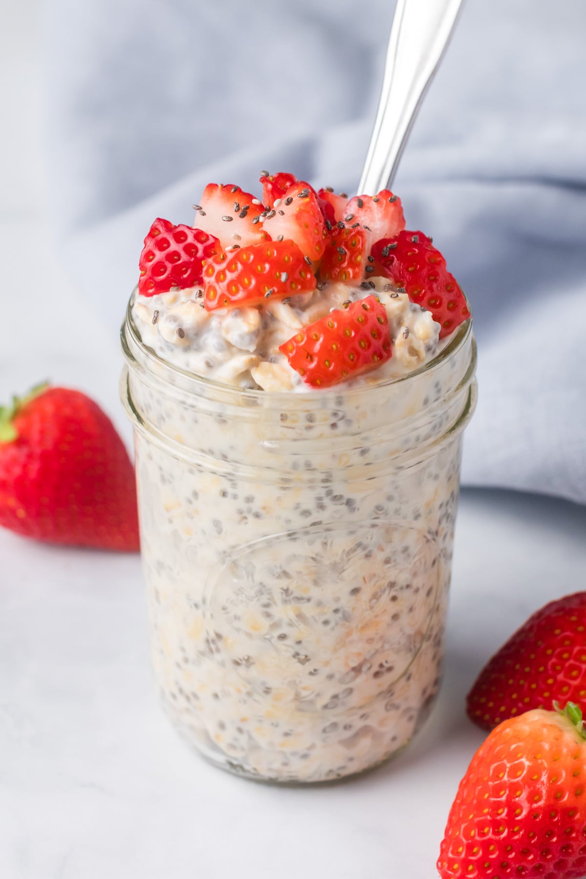 Kefir overnight oats with strawberries on top.