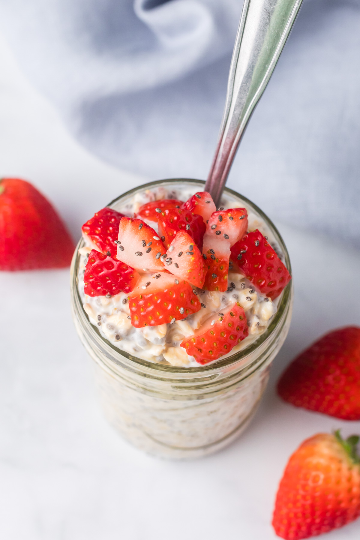 Kefir overnight oats with strawberries on top.