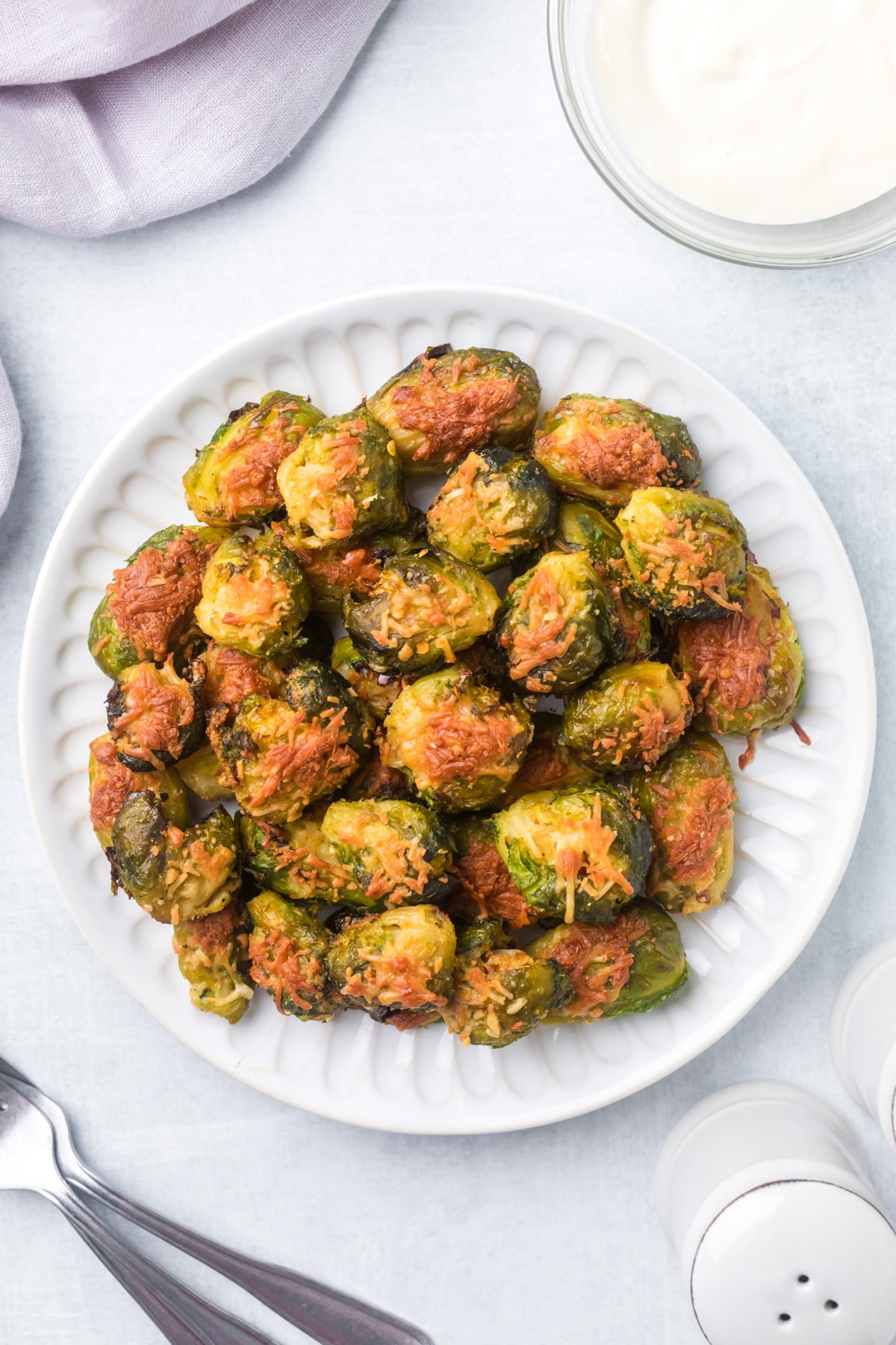 Smashed brussels sprouts on a plate.
