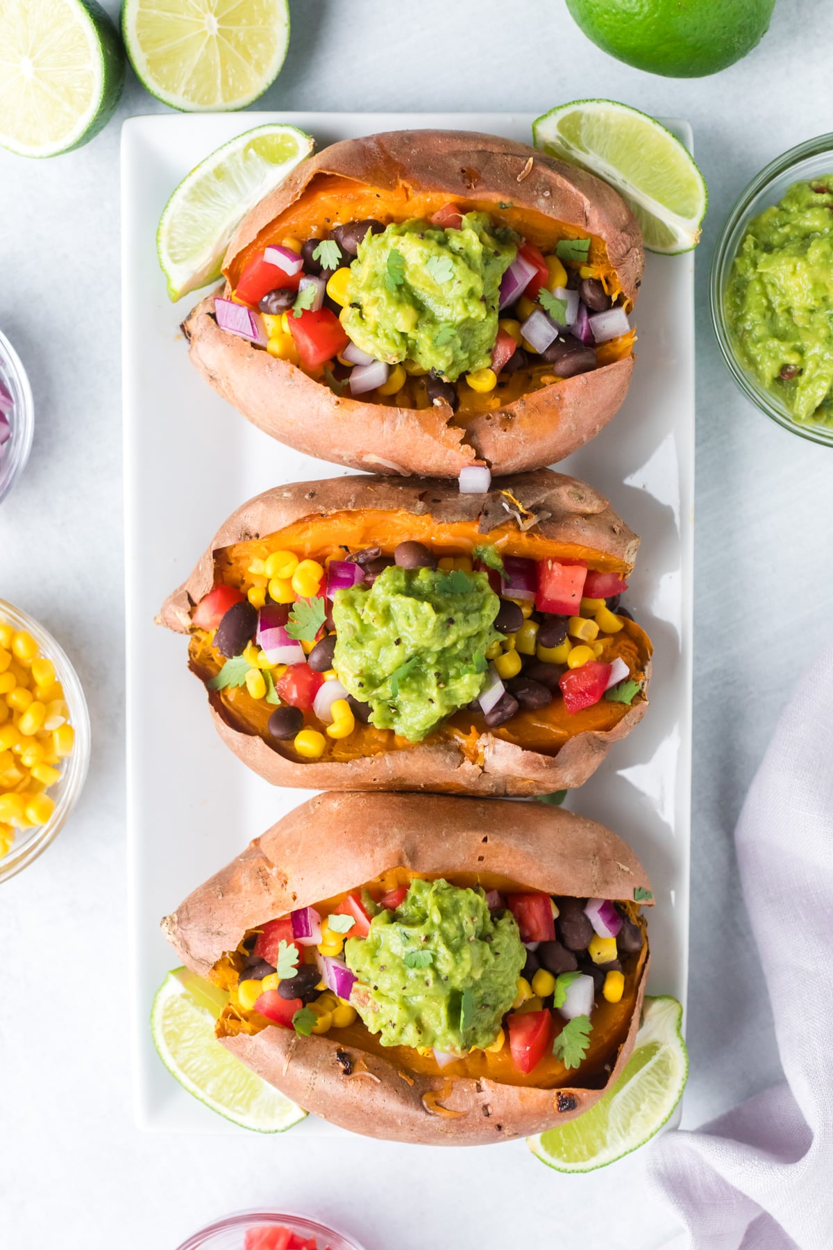 Black bean stuffed sweet potatoes on serving tray.
